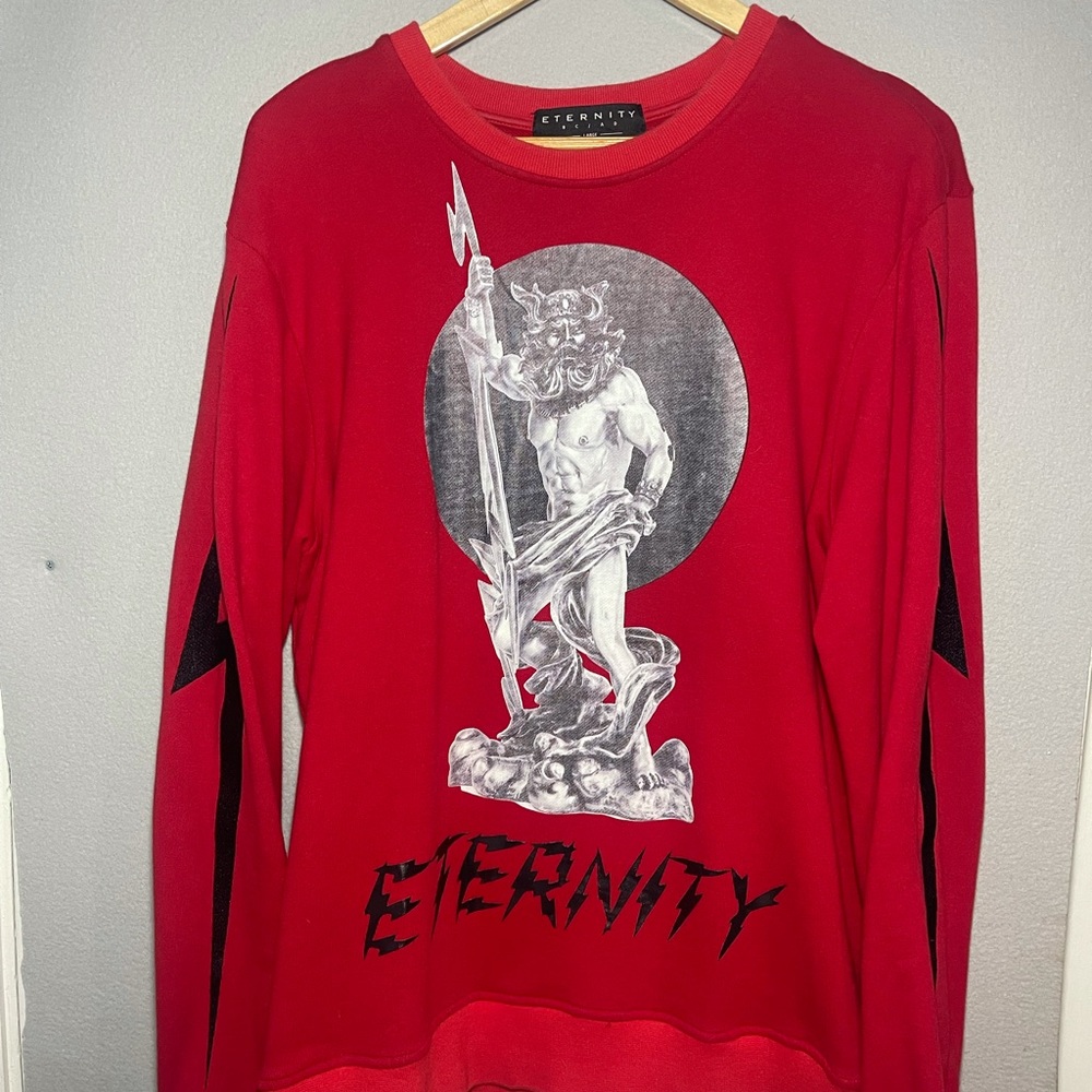 Eternity L iconic crewneck sweater.